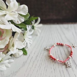 Coral Bracelet with Starfish Charms